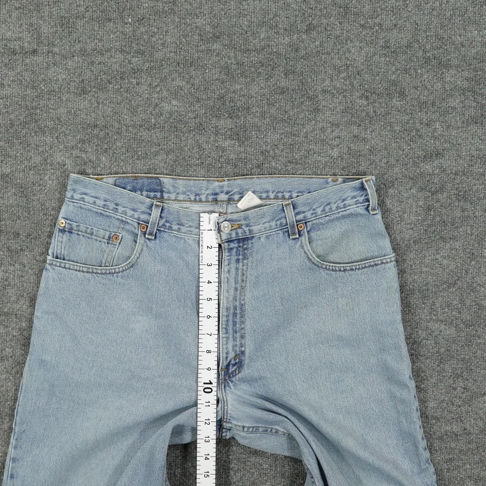 Vintage Levis 560 Jeans Mens 36x26 Light Wash Blue Relaxed Tapered Raw Hem
